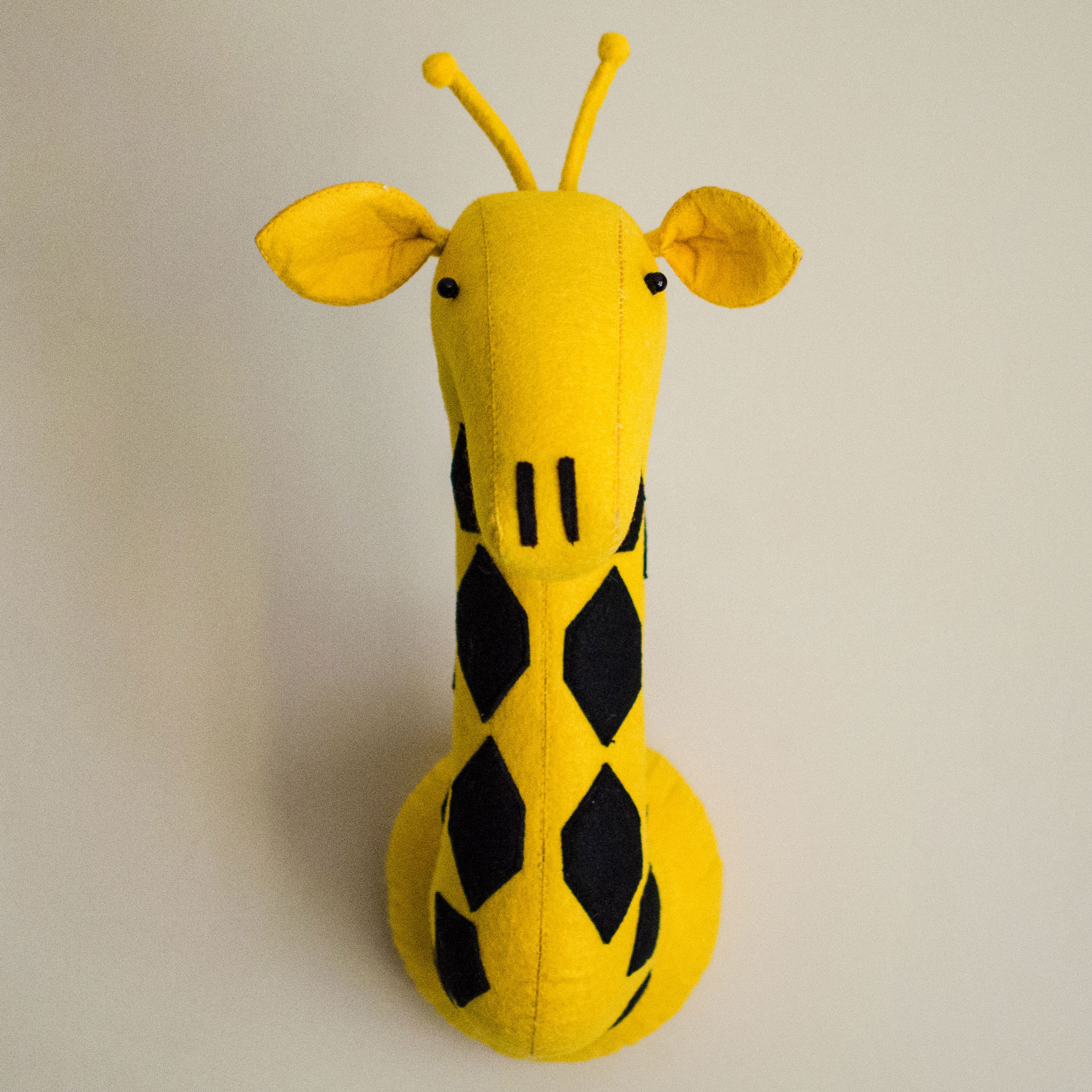 stuffed giraffe head wall mount